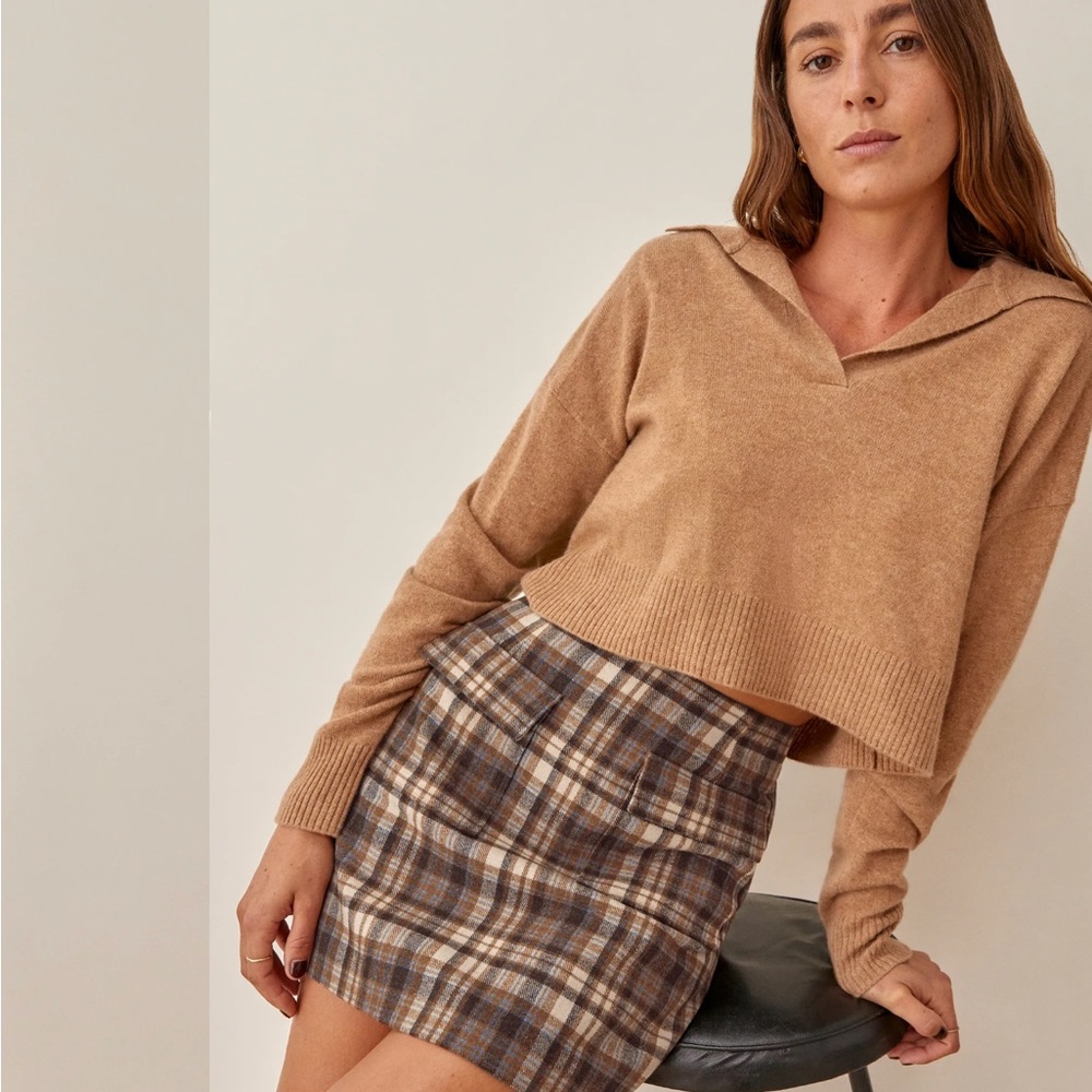 Wool blend plaid mini skirt with brown tones and front flap pockets